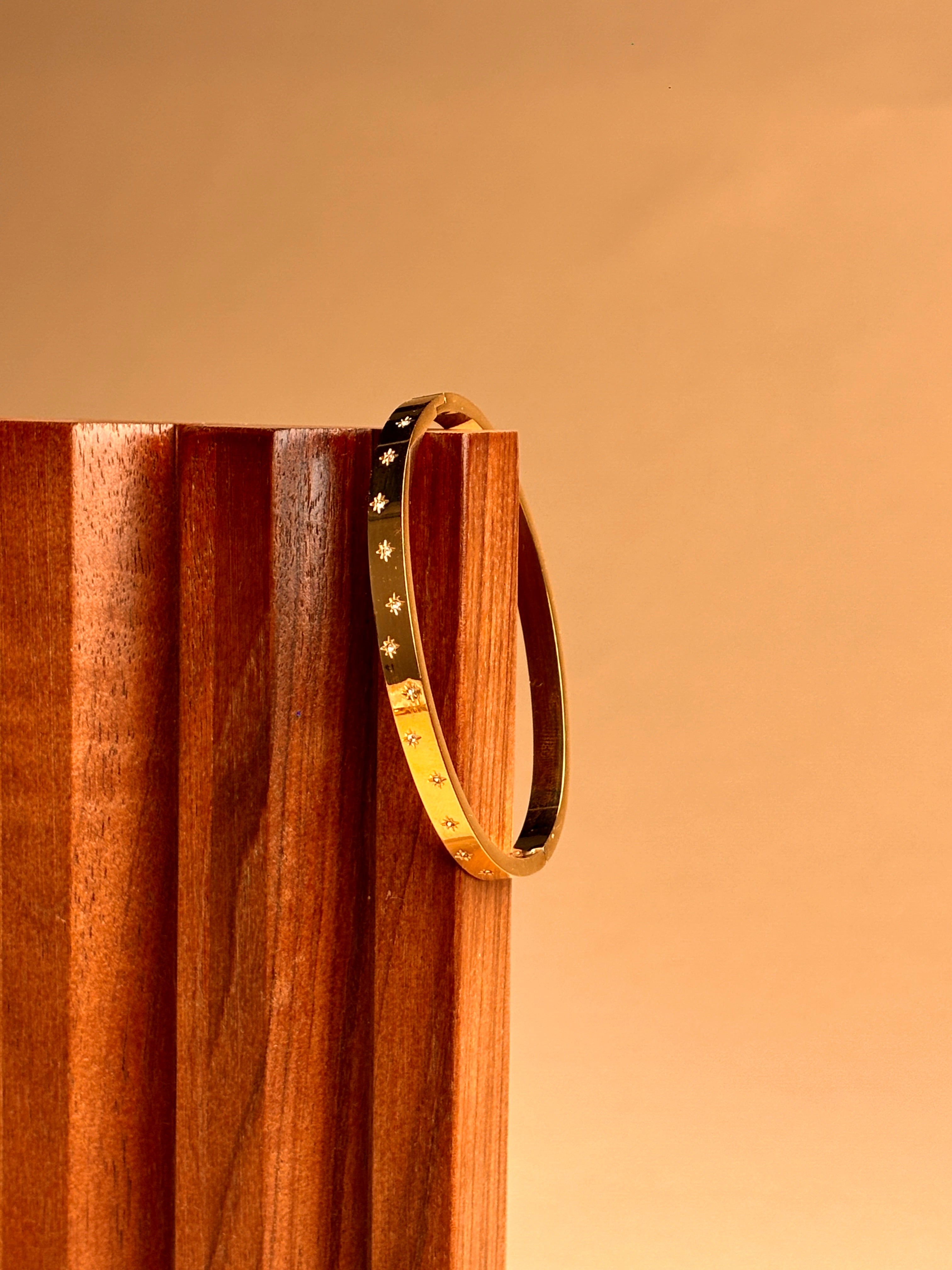 Sleek Gold Bracelet with Stone Work